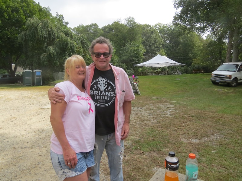 Two people in Boobstock shirts at the event venue