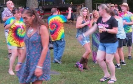 Tie-dye clad dancers at Boobstock